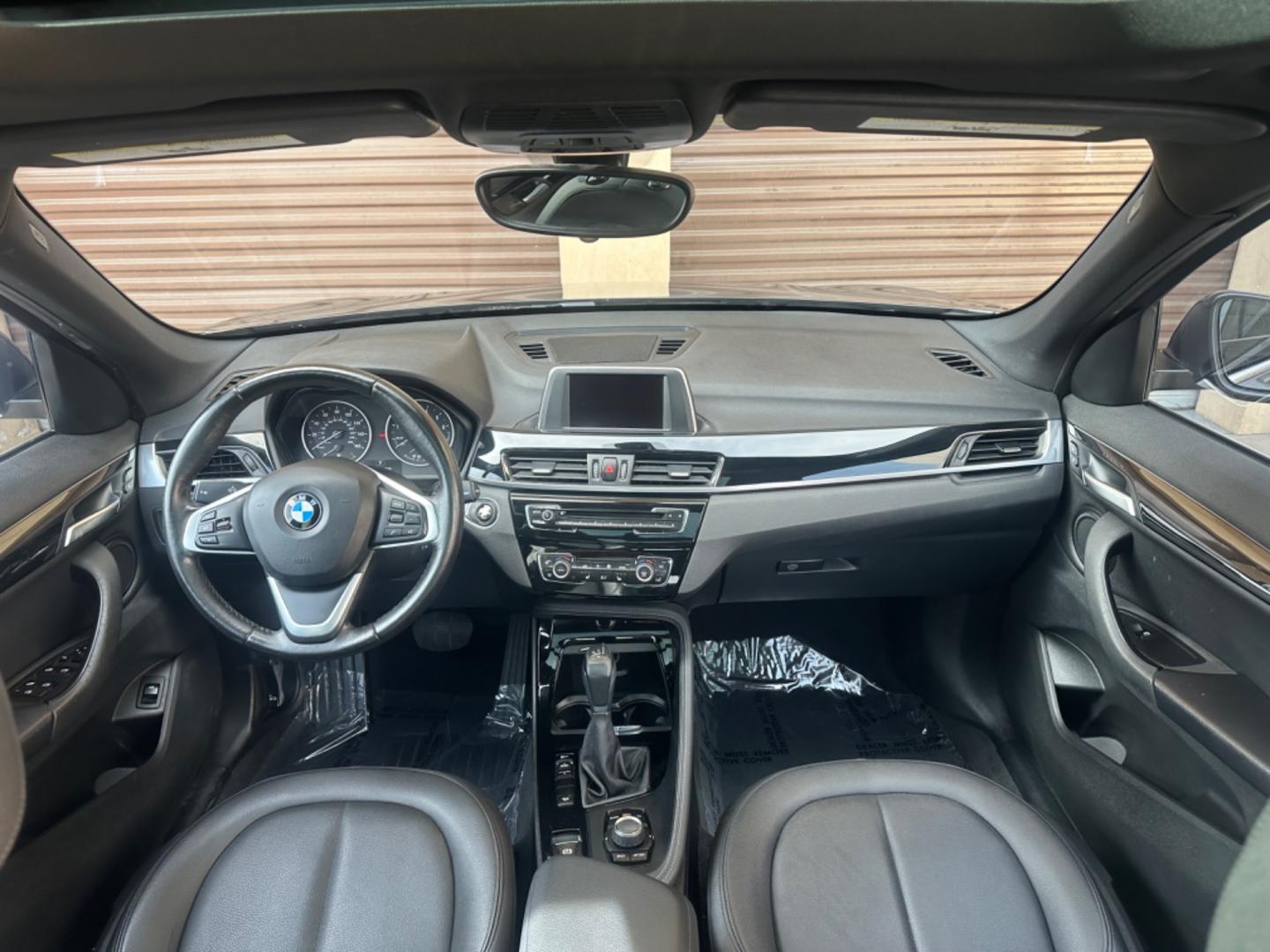 2016 Gray /Black BMW X1 leather (WBXHT3Z34G4) with an 4 CYLINDER engine, Automatic transmission, located at 30 S. Berkeley Avenue, Pasadena, CA, 91107, (626) 248-7567, 34.145447, -118.109398 - Crown City Motors is a used “Buy Here Pay Here” car dealer in Pasadena CA. “Buy Here Pay Here” financing, means that when you purchase your vehicle from our dealership, that you make the payments to the dealership as well. We do not need the banks approval to get you approved for a used auto - Photo#23